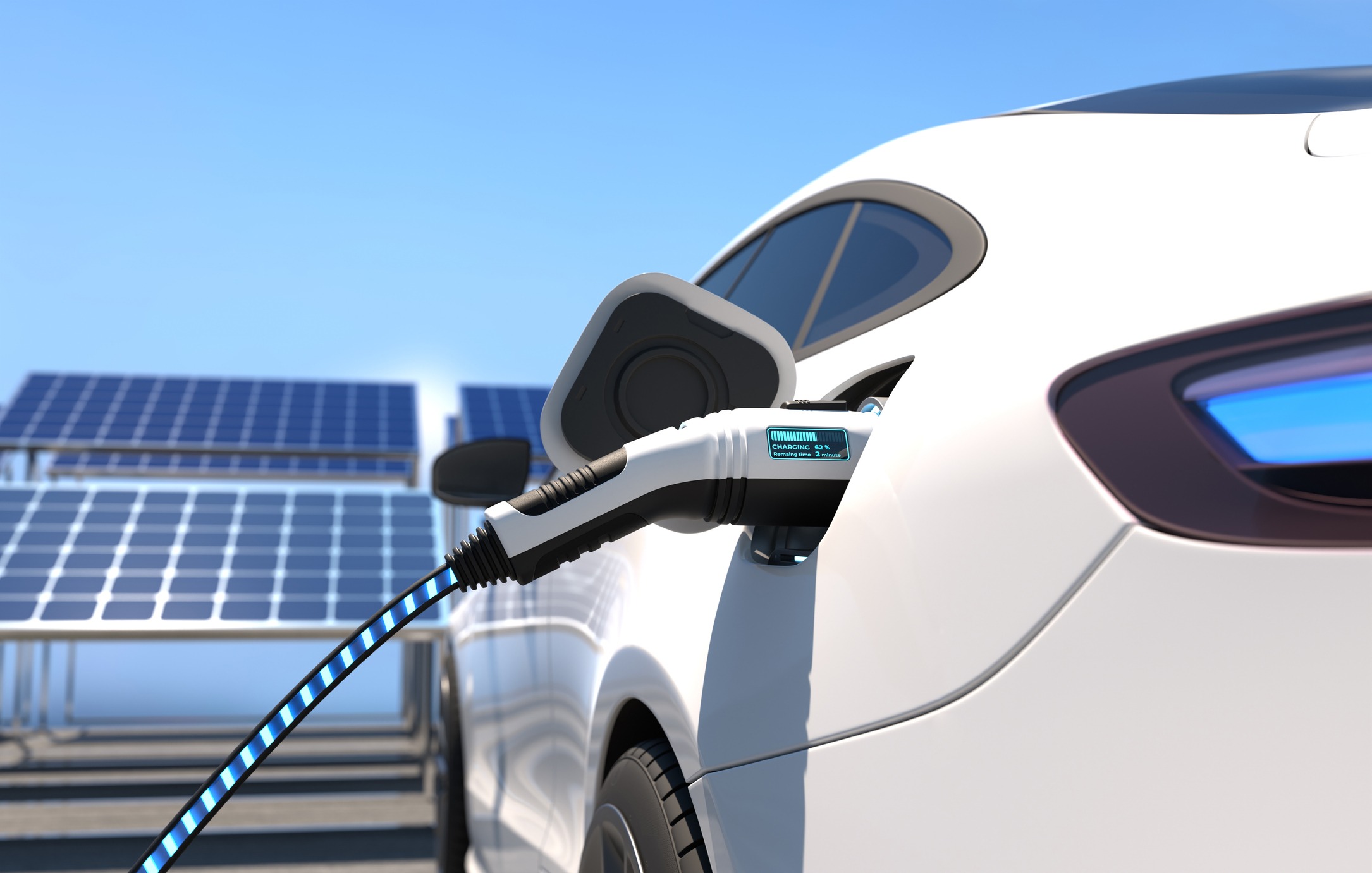 An electric vehicle is charging from a power station with solar panels in the background under a clear blue sky, showcasing clean energy use.